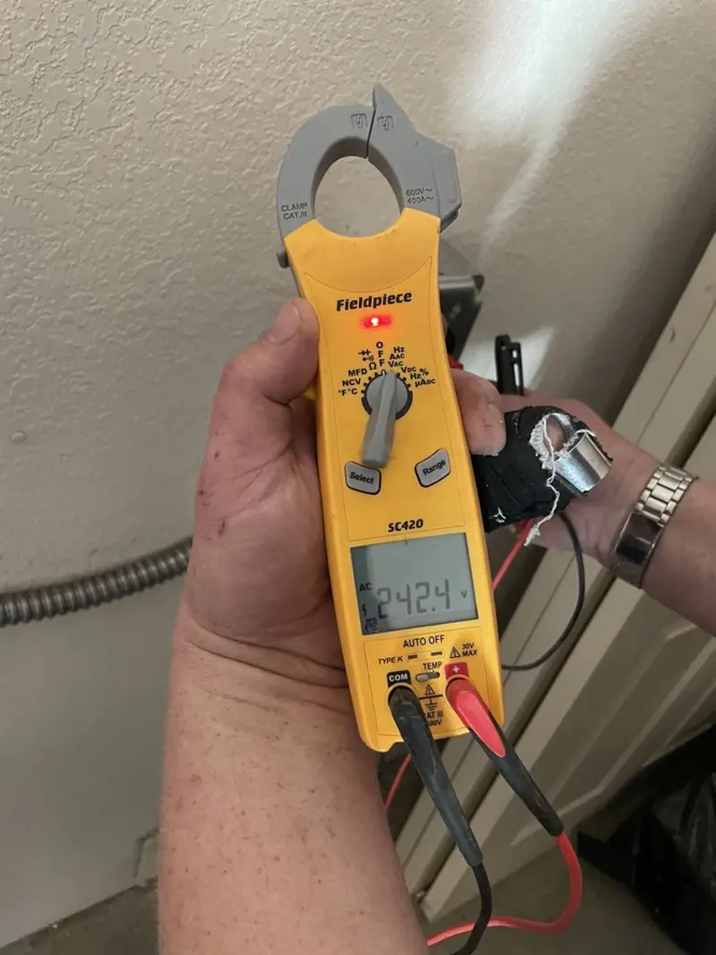 Voltage testing with clamp meter during Aluminum Wiring Replacement in Deming